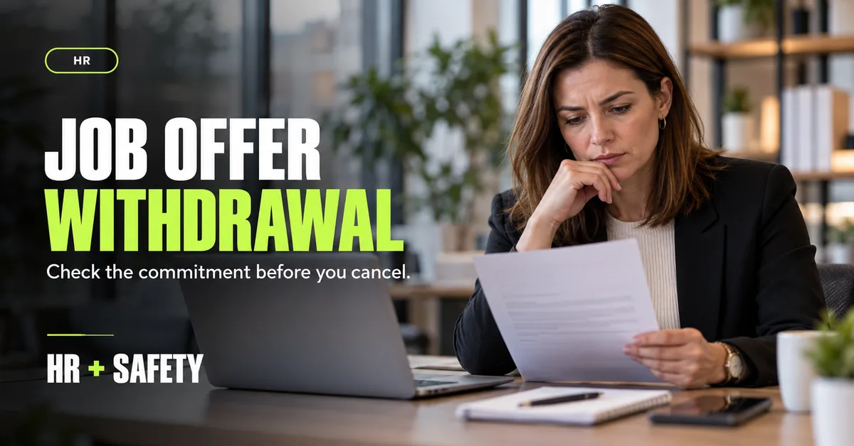 Manager reviewing a job offer and recruitment paperwork before making a decision